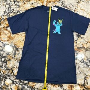 NWT Disney Monsters Inc youth SMALL Tee Shirt. Screened graphics front& back.